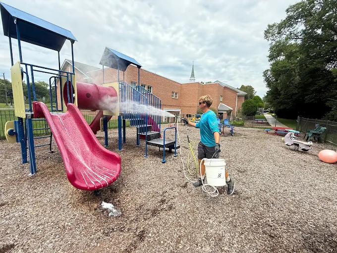 Commercial pressure washing of a playground and community amenity area